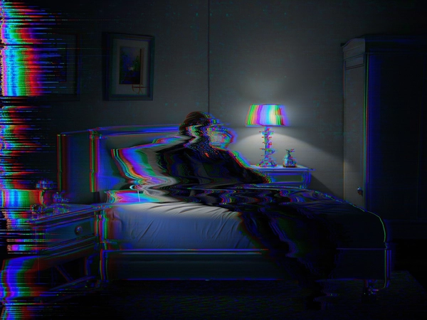 Within a dimly lit, surreal bedroom, a solitary figure reclines on a bed whose edges flicker and shift between distinct states, as if caught in a corrupted digital loop. The person's form is fragmented and wavering, distorted by intense vertical tearing and warped VHS-style glitches that ripple across their body like an analog tape struggling to load, splitting their visage and limbs into pixelated shards and warped geometric fragments. The furniture—nightstand, lamp, and dresser—pulse with unstable flickers, oscillating between clarity and digital disintegration, their outlines dissolving into moiré patterns and scan-line noise reminiscent of a failing CRT screen. Deep shadows and muted analog textures envelop the scene, interspersed with harsh horizontal static bands and subtle RGB color separation bleeding neon cyan, magenta, and electric blue along edges, conjuring an atmosphere suspended between dream and corrupted data reality. Tightly framed to focus on the bed and its ghostly occupant, the composition merges human vulnerability with eerie technological decay, evoking themes of interrupted identity and existential alienation within a glitching simulation.