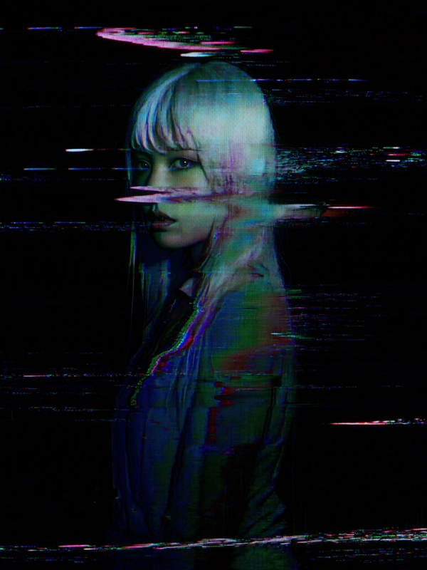 Bathed in the intermittent flicker of a lone streetlight, a young woman with platinum hair stands frozen, her delicate outline fractured by compression artifacts and frozen motion blur that ripple across her form like a buffering video stuck in time. Her eyes, wide with quiet contemplation, shimmer faintly beneath layered digital distortions that slice horizontally and vertically through her visage. Partially pixelated and warped, her profile warps under bands of glitchy interference, with RGB color separation bleeding subtle hues of cyan and magenta along her flowing strands of hair. The composition tightly crops the figure against a pitch-black background that pulses with faint, moiré static, giving the impression of an analog CRT screen struggling to maintain signal integrity. The grainy texture overlays scan lines and pixel noise, enhancing the tactile sensation of decaying digital media. The atmosphere resonates with a haunting fusion of cyberpunk melancholy and existential alienation, evoking themes of identity loss and suspended existence within corrupted data streams.