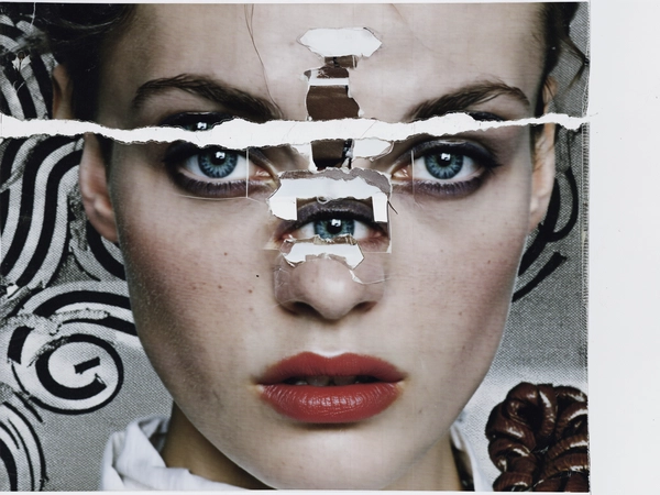 Her face is dissected into overlapping layers—icy blue eyes are repeated thrice, one set inverted and shifted toward the temple, another floating near the jawline. Her mouth is split diagonally, the upper lip displaced upward and doubled in translucent print. The nose bridge fractures into two separate strips, one pasted askew beneath her cheek, creating an unsettling, disjointed symmetry. Jagged torn paper edges and masking tape fragments hold each facial element in place, building a tactile construction reminiscent of punk-era photocopy collage.
Her skin bears matte whiteness with visible pores and faint freckles, echoing the soft texture of a worn newsprint. The matte white fabric of her dress blends into a grainy xerox background peppered with halftone spirals, mirroring the coiled leather belt motif. Scratched ink marks and ripped paper seams frame the composition, emphasizing the handmade analog aesthetic.
